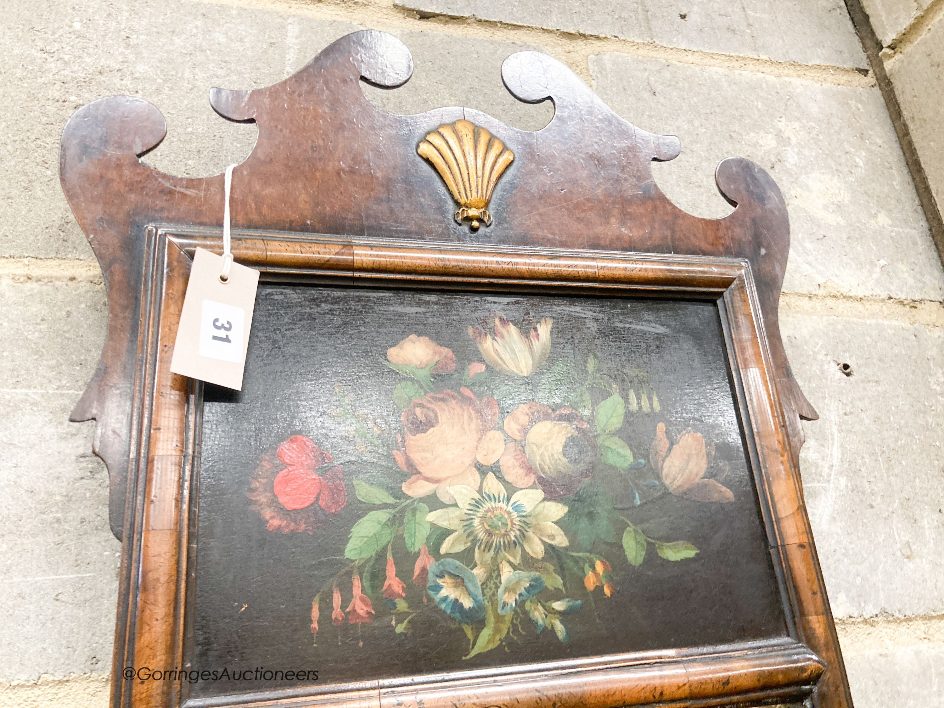 A George I style painted walnut fret cut wall mirror, width 46cm, height 107cm